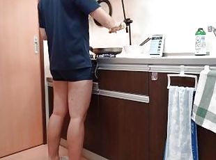 A man making kimbap in pants
