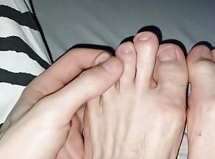Skinny cute feet fingers stretched out bitten nails