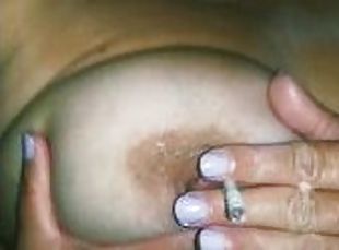 girl smokes a cigarette and plays with her tits