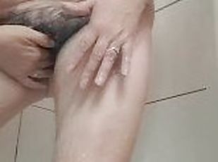mature milf washing the cum that drips on her body