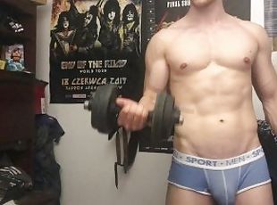 Chris Wild doing biceps curls and masturbates his big cock