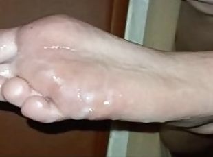 Worshipping hands and sweaty feet of a young blonde and covering her soles with cum