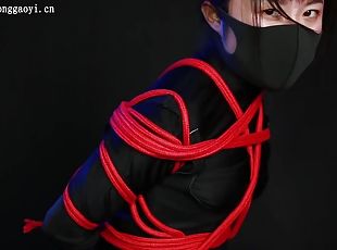 Ninja Girl Tied In Red Ropes