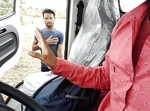 The college boy sitting in the car towards the forest goes down to the pit to use the bathroom