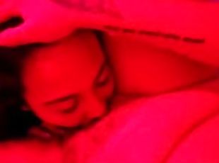 Eating her pussy under the pink light