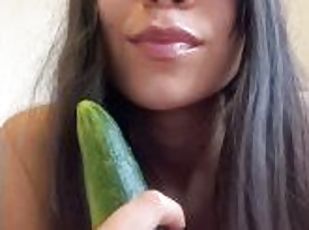 Sucking a cucumber