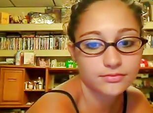 Babe in cute glasses is fucking on the webcam