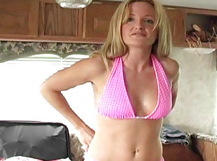 Blonde Kay D is taking her nice looking pink bra