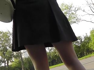 Sexy chick is walking in a hot short dress