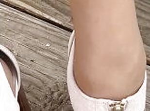 Her perfect pink toes in tan nylons and capri jeans