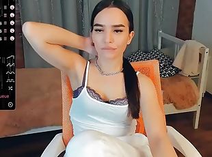 Sporty asian camgirl strips and sucks a short dildo